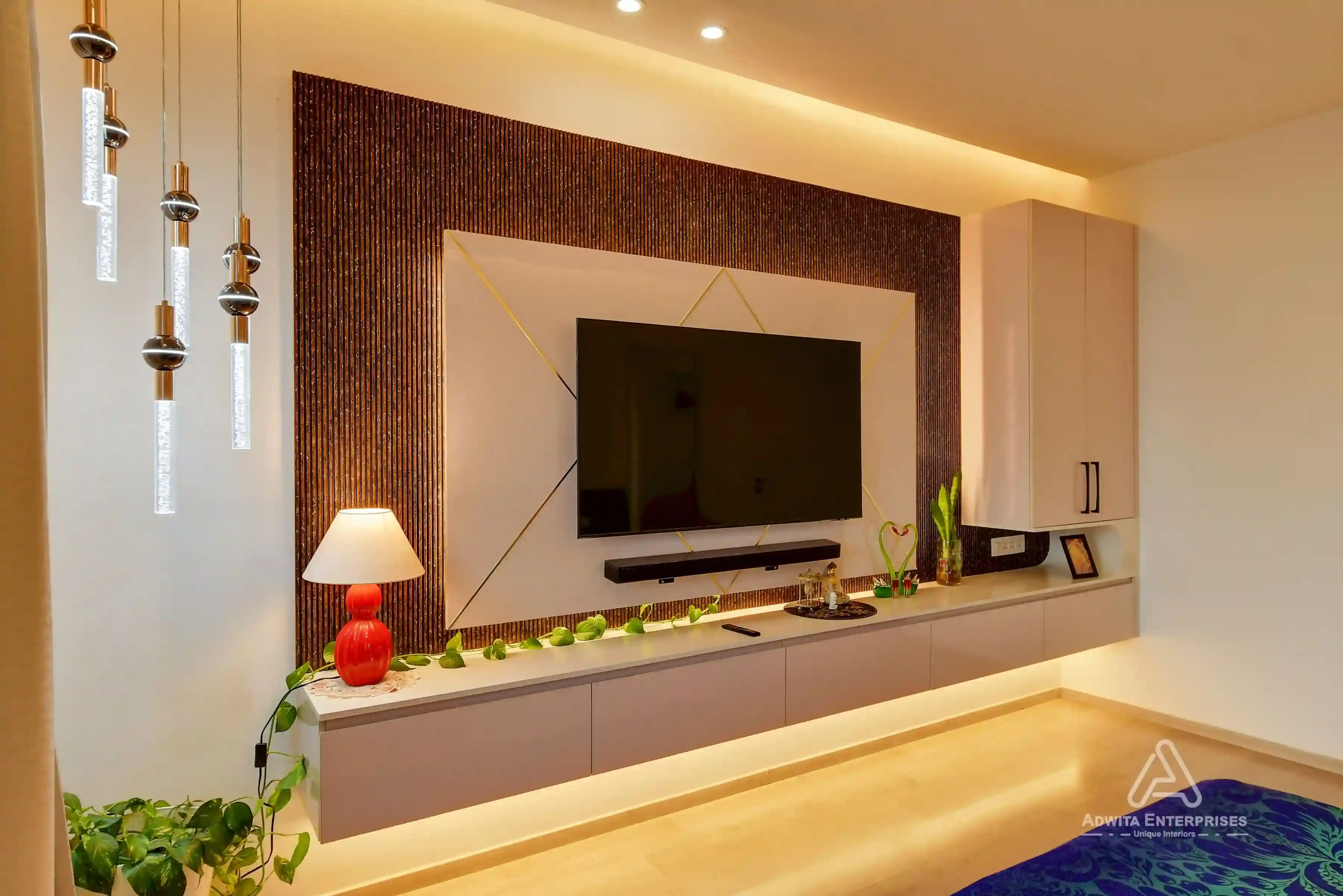 Modern TV unit design with sleek storage cabinets and elegant wall paneling