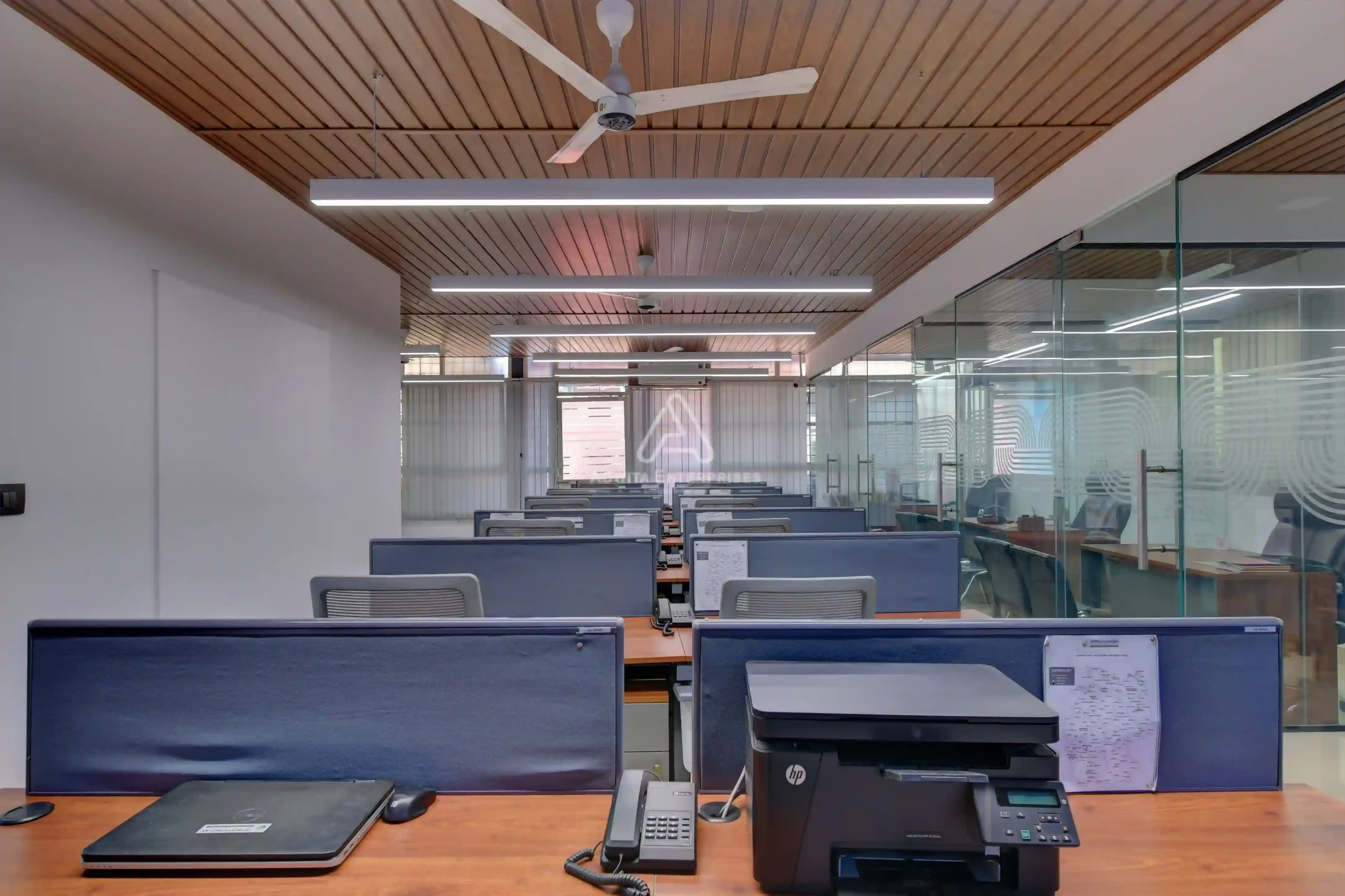 Workstation area with ergonomic desks, chairs, and modern office design