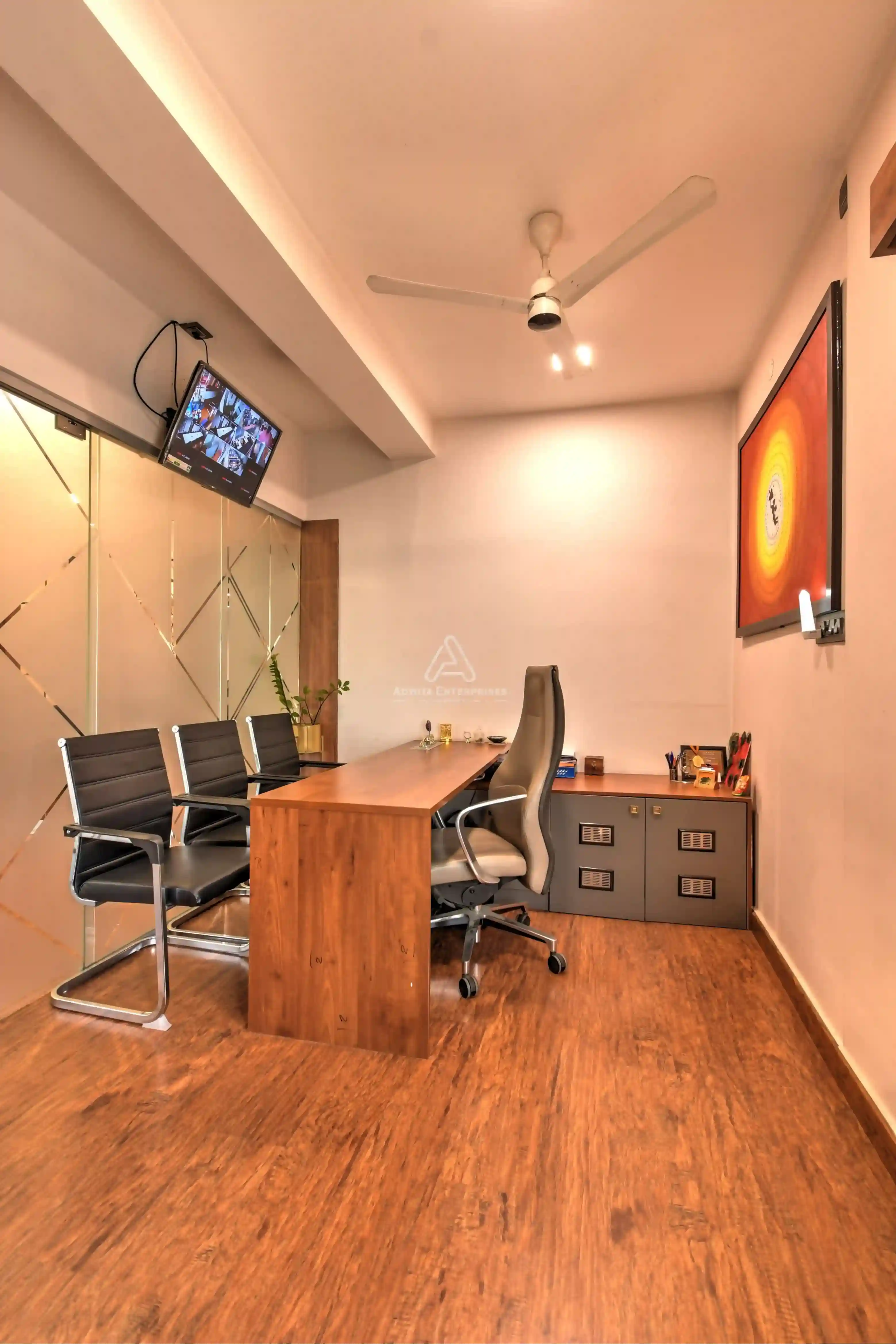 MD cabin with executive desk, chair, and seating area