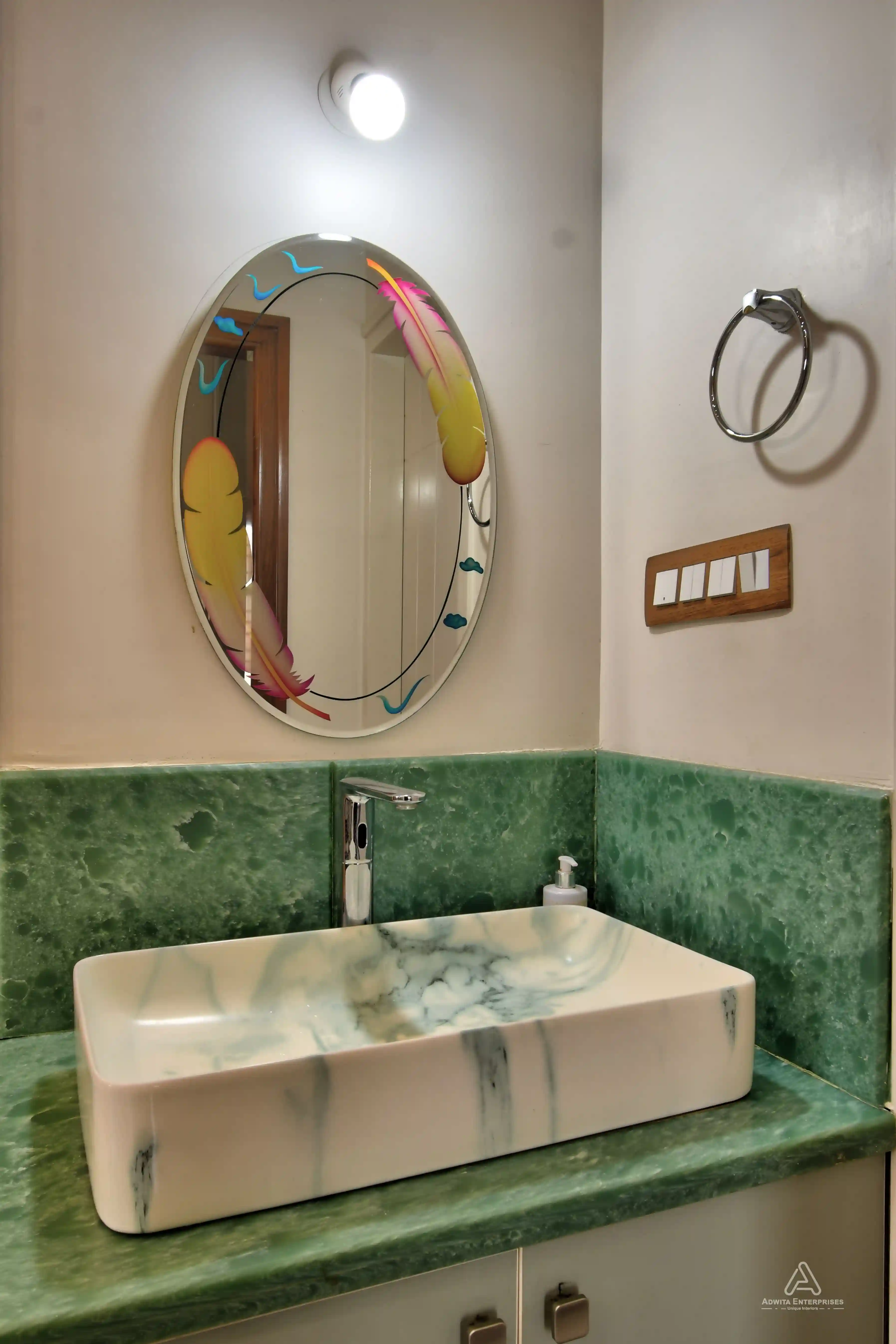 Modern kitchen featuring a sink, neat cabinets, and smart storage