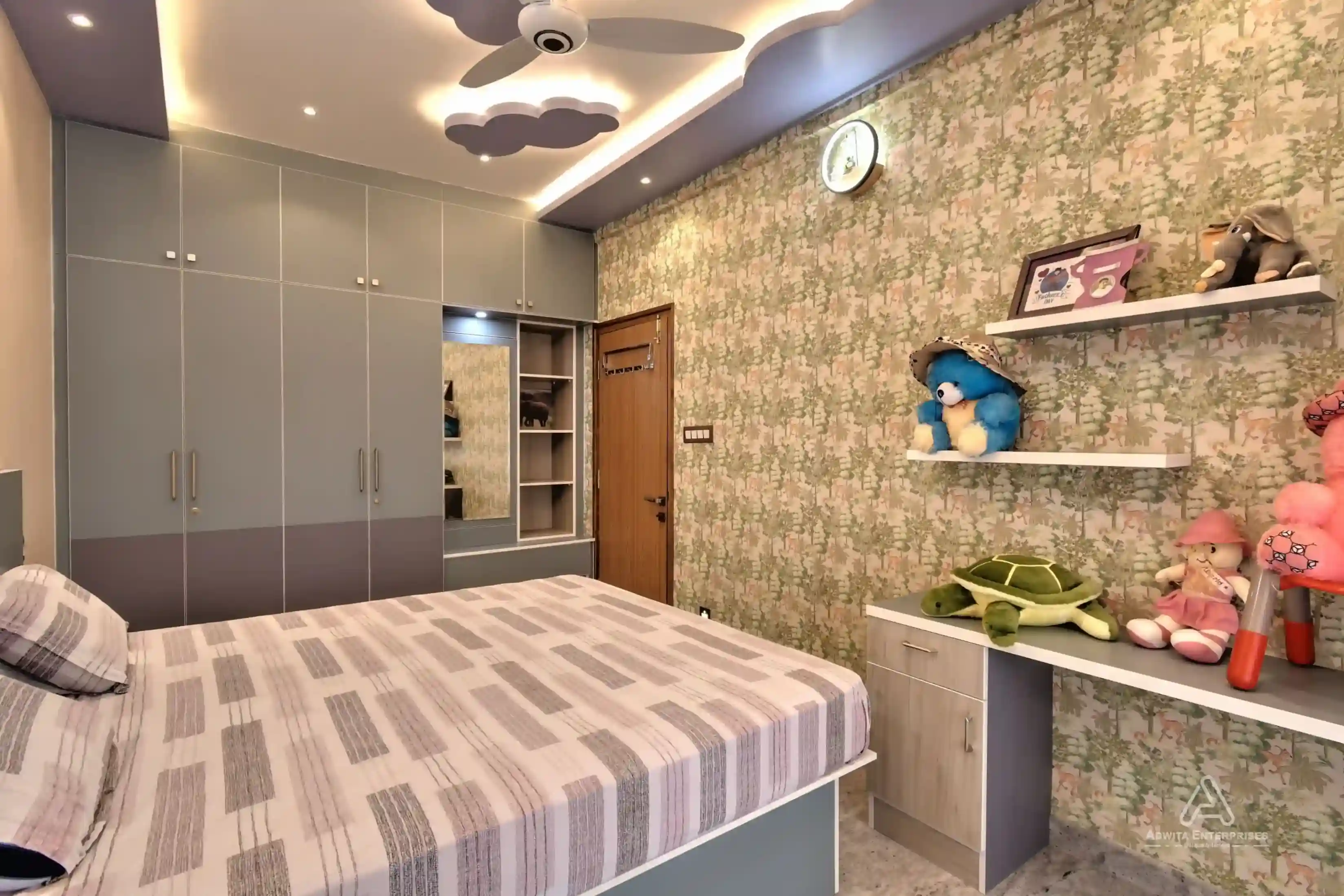 Child's bedroom with bed, study desk, and storage shelves